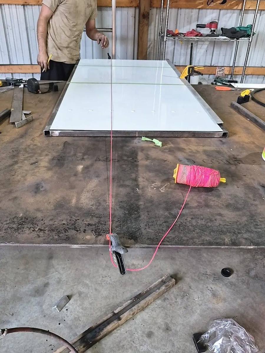Drilling a fastener pattern through a panel set in a welded steel frame on the Pro-Line shop floor in Piketon, Ohio