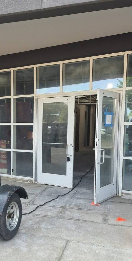 Welding lead run in through the door of a commercial building on an on-site job