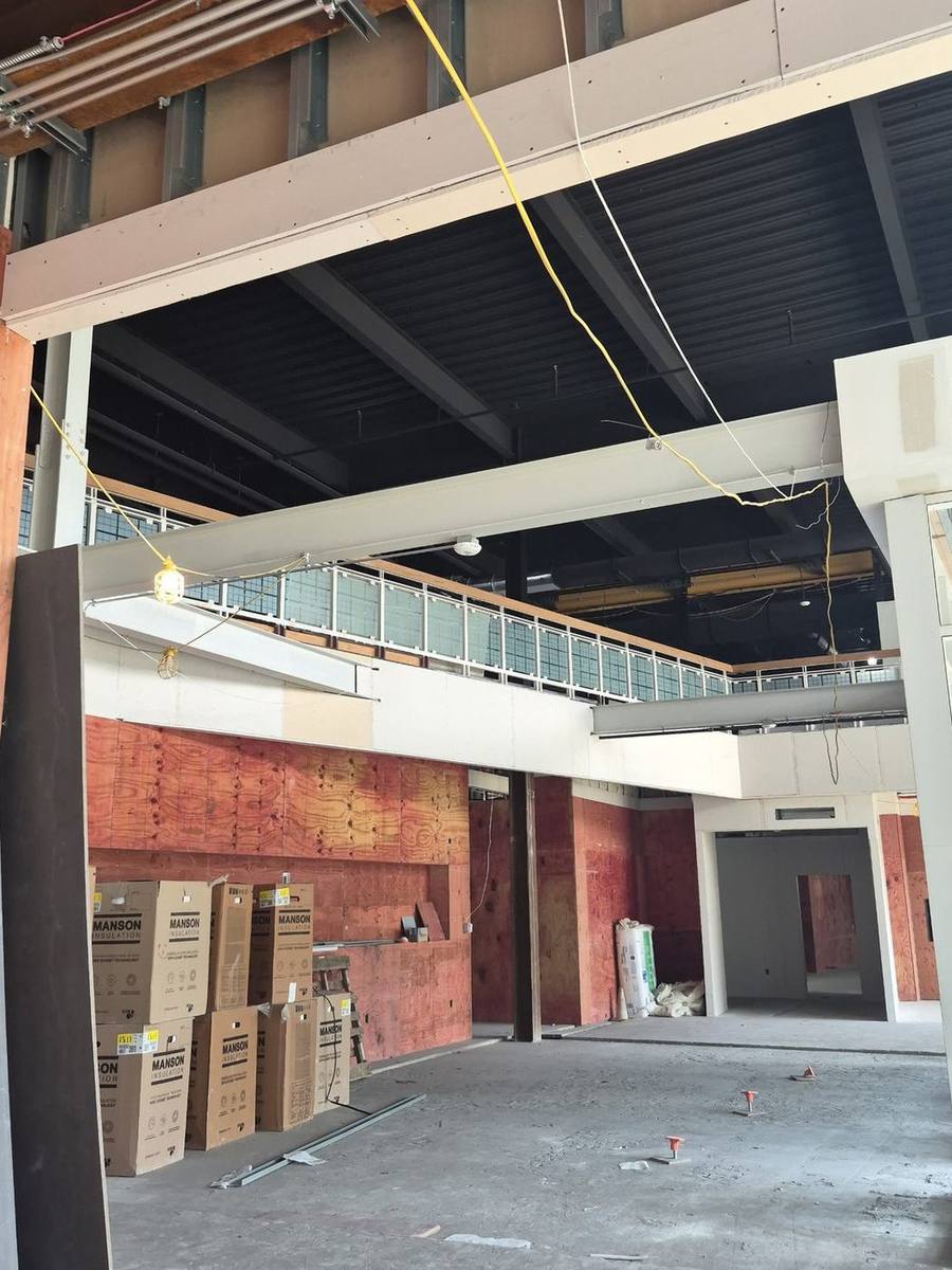 Structural steel and a steel mezzanine railing installed in a commercial building under construction